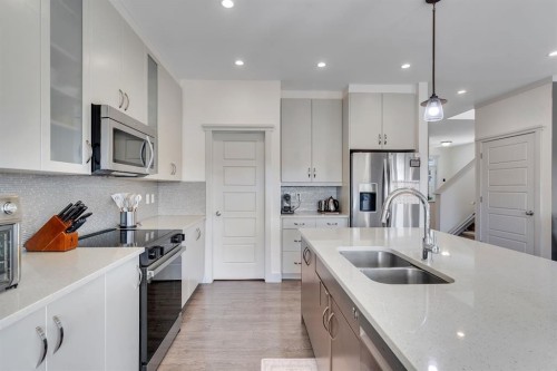 49 Marquis Grove Se, Calgary, AB - Indoor Photo Showing Kitchen With Stainless Steel Kitchen With Double Sink With Upgraded Kitchen