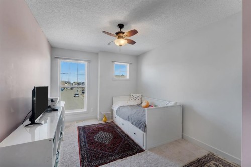49 Marquis Grove Se, Calgary, AB - Indoor Photo Showing Bedroom