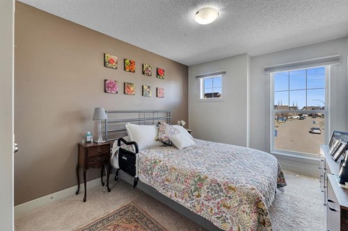 49 Marquis Grove Se, Calgary, AB - Indoor Photo Showing Bedroom