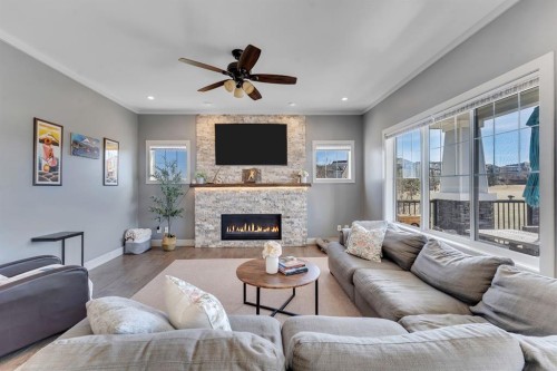 49 Marquis Grove Se, Calgary, AB - Indoor Photo Showing Living Room With Fireplace