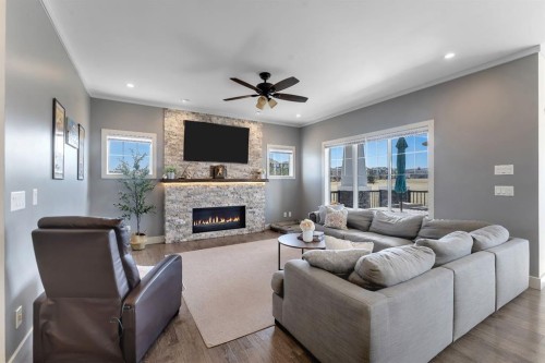 49 Marquis Grove Se, Calgary, AB - Indoor Photo Showing Living Room With Fireplace