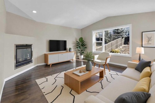 24 Evansbrooke Point Nw, Calgary, AB - Indoor Photo Showing Living Room With Fireplace