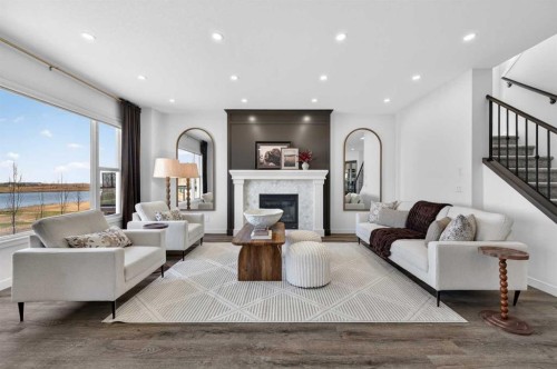 85 Boulder Creek Manor Se, Langdon, AB - Indoor Photo Showing Living Room With Fireplace