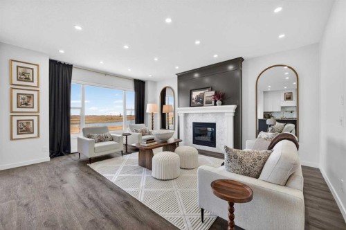 85 Boulder Creek Manor Se, Langdon, AB - Indoor Photo Showing Living Room With Fireplace