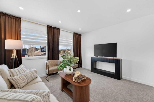 85 Boulder Creek Manor Se, Langdon, AB - Indoor Photo Showing Living Room