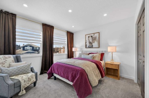 85 Boulder Creek Manor Se, Langdon, AB - Indoor Photo Showing Bedroom