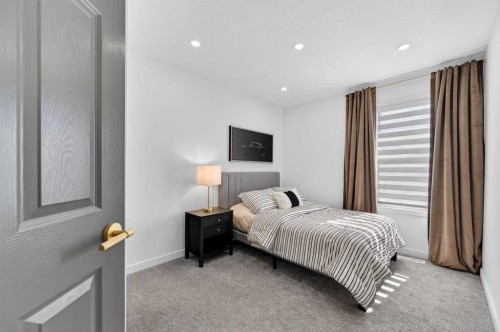 85 Boulder Creek Manor Se, Langdon, AB - Indoor Photo Showing Bedroom