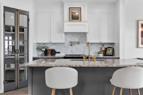 85 Boulder Creek Manor Se, Langdon, AB - Indoor Photo Showing Kitchen With Upgraded Kitchen