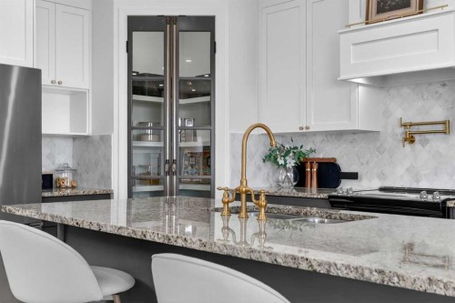 85 Boulder Creek Manor Se, Langdon, AB - Indoor Photo Showing Kitchen With Upgraded Kitchen