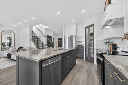 85 Boulder Creek Manor Se, Langdon, AB - Indoor Photo Showing Kitchen With Double Sink With Upgraded Kitchen