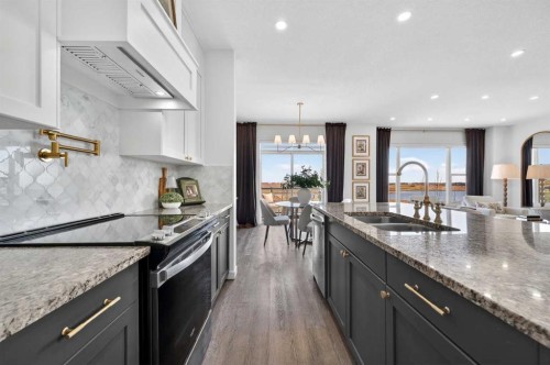 85 Boulder Creek Manor Se, Langdon, AB - Indoor Photo Showing Kitchen With Double Sink With Upgraded Kitchen