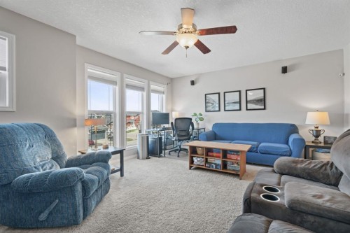 49 Kingsbridge Place Se, Airdrie, AB - Indoor Photo Showing Living Room