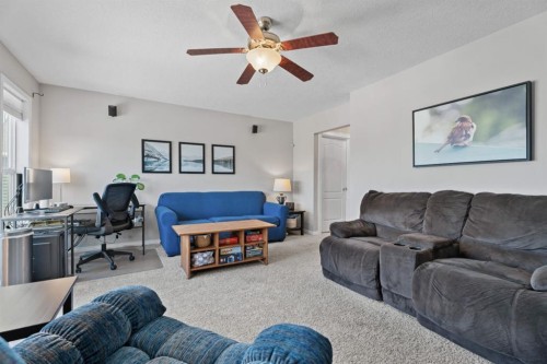 49 Kingsbridge Place Se, Airdrie, AB - Indoor Photo Showing Living Room