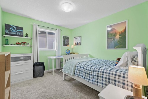 49 Kingsbridge Place Se, Airdrie, AB - Indoor Photo Showing Bedroom