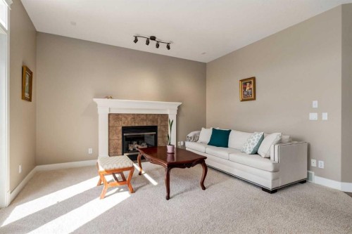 72 Wentworth Crescent Sw, Calgary, AB - Indoor Photo Showing Living Room With Fireplace