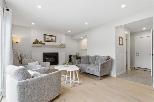 832 Edgemont Road Nw, Calgary, AB - Indoor Photo Showing Living Room With Fireplace