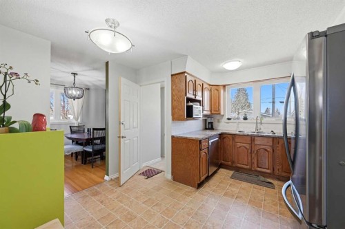1012 Riddell Place Se, Calgary, AB - Indoor Photo Showing Kitchen With Double Sink