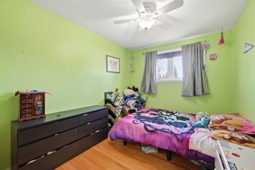 1012 Riddell Place Se, Calgary, AB - Indoor Photo Showing Bedroom
