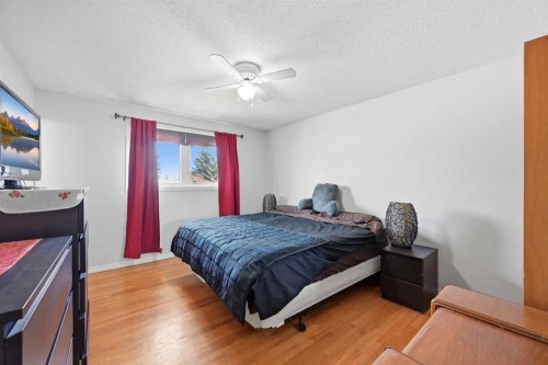 1012 Riddell Place Se, Calgary, AB - Indoor Photo Showing Bedroom