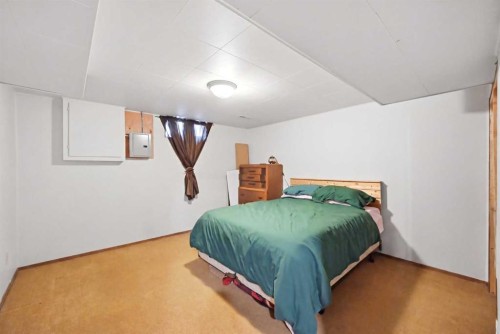 1012 Riddell Place Se, Calgary, AB - Indoor Photo Showing Bedroom