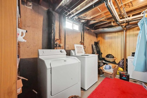 1012 Riddell Place Se, Calgary, AB - Indoor Photo Showing Laundry Room