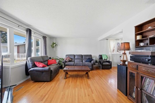1012 Riddell Place Se, Calgary, AB - Indoor Photo Showing Living Room