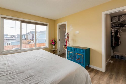 140 Emberside Glen, Cochrane, AB - Indoor Photo Showing Bedroom