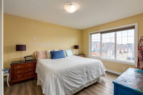 140 Emberside Glen, Cochrane, AB - Indoor Photo Showing Bedroom