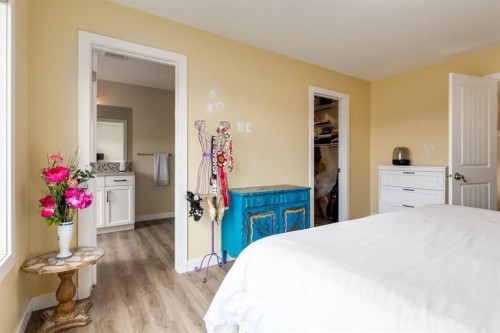 140 Emberside Glen, Cochrane, AB - Indoor Photo Showing Bedroom