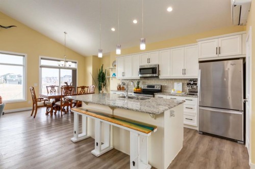 140 Emberside Glen, Cochrane, AB - Indoor Photo Showing Kitchen With Stainless Steel Kitchen With Upgraded Kitchen