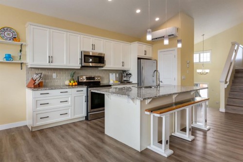 140 Emberside Glen, Cochrane, AB - Indoor Photo Showing Kitchen With Stainless Steel Kitchen With Upgraded Kitchen
