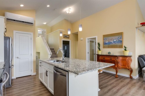 140 Emberside Glen, Cochrane, AB - Indoor Photo Showing Kitchen With Double Sink With Upgraded Kitchen