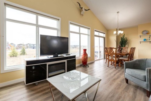 140 Emberside Glen, Cochrane, AB - Indoor Photo Showing Living Room