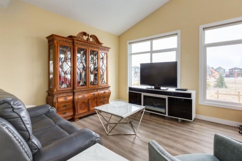 140 Emberside Glen, Cochrane, AB - Indoor Photo Showing Living Room