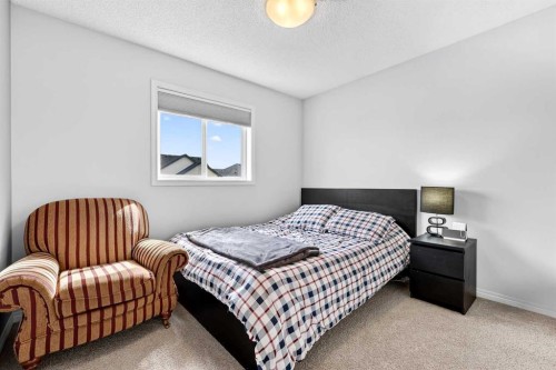 27 Copperpond Heights Se, Calgary, AB - Indoor Photo Showing Bedroom