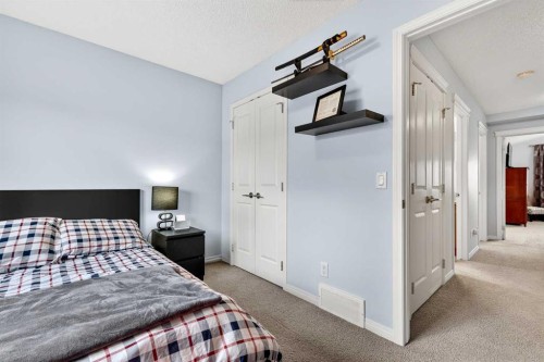 27 Copperpond Heights Se, Calgary, AB - Indoor Photo Showing Bedroom