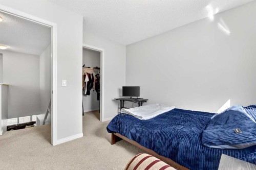 27 Copperpond Heights Se, Calgary, AB - Indoor Photo Showing Bedroom