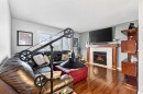 27 Copperpond Heights Se, Calgary, AB  - Indoor Photo Showing Living Room With Fireplace 