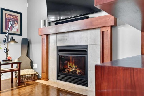 27 Copperpond Heights Se, Calgary, AB - Indoor Photo Showing Living Room With Fireplace