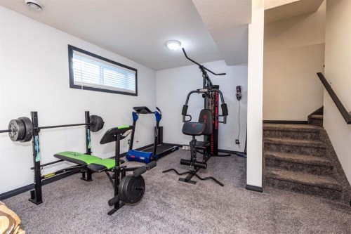 27 Sage Hill Common Nw, Calgary, AB - Indoor Photo Showing Gym Room