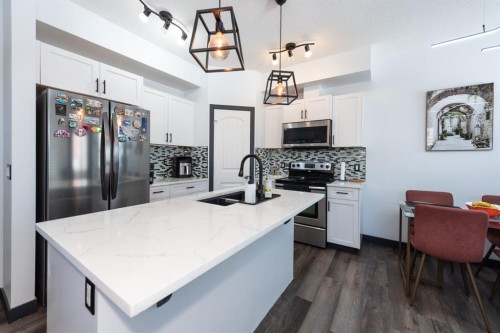 27 Sage Hill Common Nw, Calgary, AB - Indoor Photo Showing Kitchen With Double Sink With Upgraded Kitchen