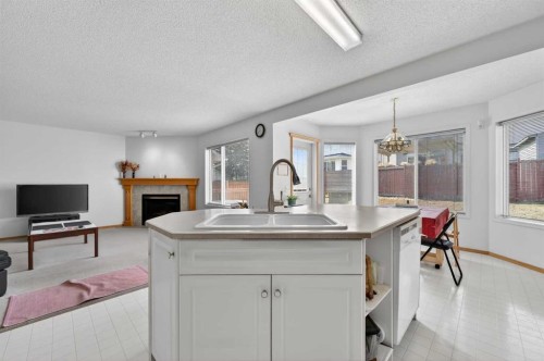 718 Coral Springs Boulevard Ne, Calgary, AB - Indoor With Fireplace