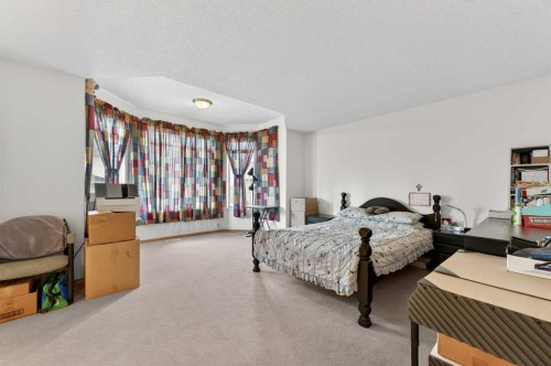 718 Coral Springs Boulevard Ne, Calgary, AB - Indoor Photo Showing Bedroom
