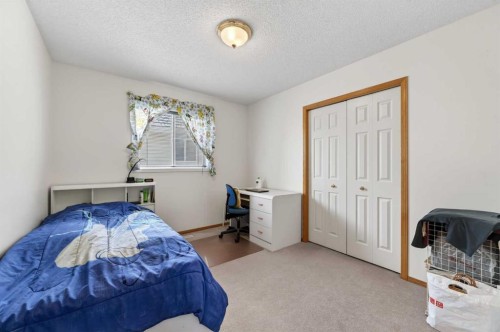 718 Coral Springs Boulevard Ne, Calgary, AB - Indoor Photo Showing Bedroom