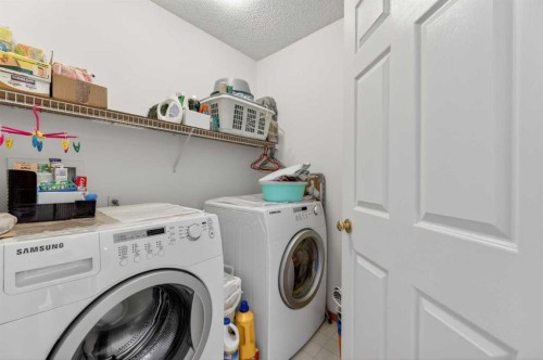 718 Coral Springs Boulevard Ne, Calgary, AB - Indoor Photo Showing Laundry Room