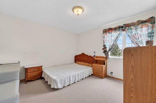 718 Coral Springs Boulevard Ne, Calgary, AB - Indoor Photo Showing Bedroom
