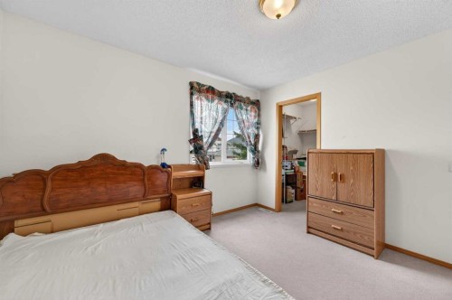 718 Coral Springs Boulevard Ne, Calgary, AB - Indoor Photo Showing Bedroom