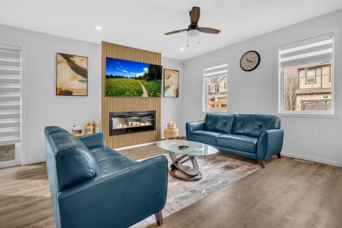 271 Carringham Road Nw, Calgary, AB - Indoor Photo Showing Living Room With Fireplace