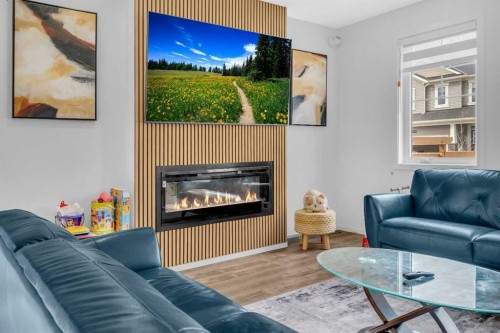 271 Carringham Road Nw, Calgary, AB - Indoor Photo Showing Living Room With Fireplace