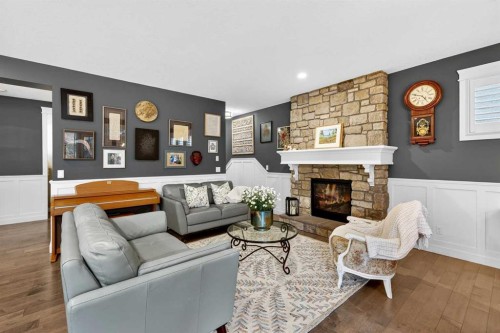 90 Cranbrook Hill Se, Calgary, AB - Indoor Photo Showing Living Room With Fireplace
